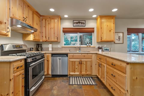Beautiful kitchen with updated stainless steel appliances.