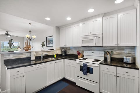 Kitchen, fully stocked with cooking/eating/drinking utensils