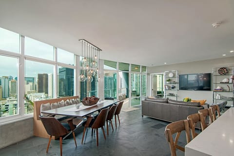 The main room has a beautiful dining table with custom bench and room for 8