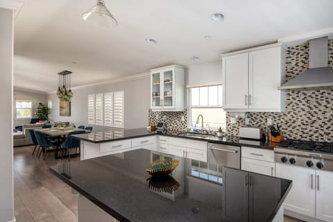 The modern kitchen is equipped with high-end appliances and all the tools you need prepare a delicious home-cooked meal.