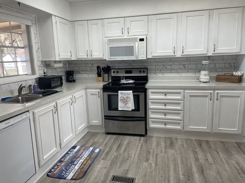 Kitchen with dishwasher and other amenities