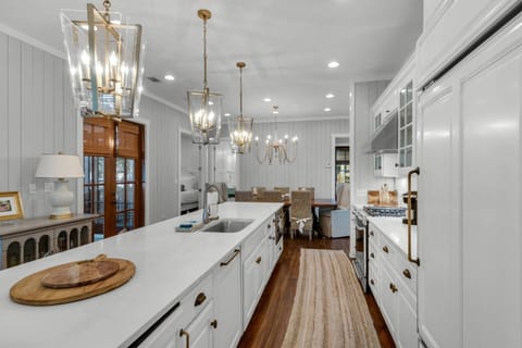 Well-organized kitchen with labels and kitchenware to meet all cooking needs (high-quality pots, pans, sharp knives, Tupperware containers, etc.).