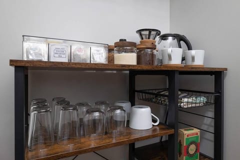 Coffee/tea cart with a large selection of teas, coffee, and sweeteners