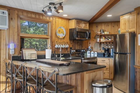 Fully equipped kitchen with bar seating