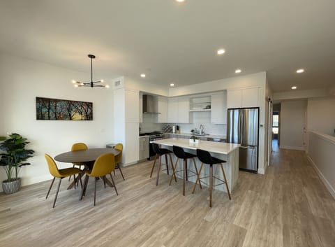 Kitchen and dining area with eat at island