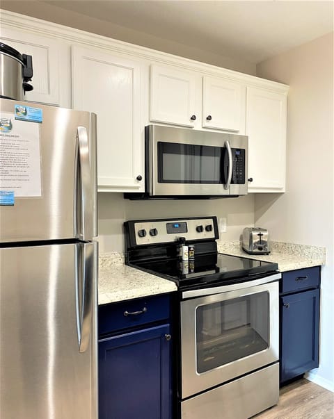 Newly remodeled kitchen has full size appliances and granite countertops