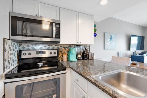 Stainless Appliances and Lovely Tilework