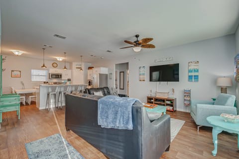 Cozy living room with board games, Xbox, and large smart TV.