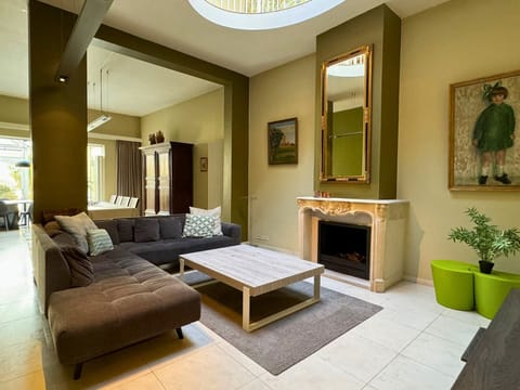 Living room with seating area and television. Stove doesn't work for fire safety