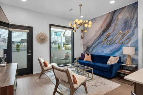 Spacious living room with pullout couch and patio facing outdoor pool! Smart TV with all the apps you could want.