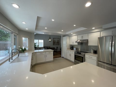 Chef's kitchen with custom cabinetry, quartz countertops, and Bosch appliances
