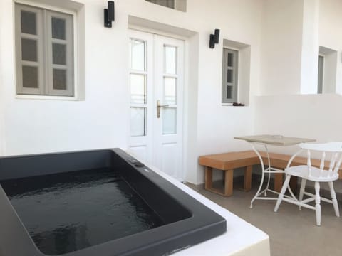 Hot tub and outdoors seating area