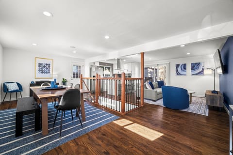 Bright, spotless open-concept living area, perfect for groups to relax and connect.