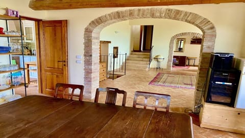 Dining room with wine fridge, ice maker & additional fridge.