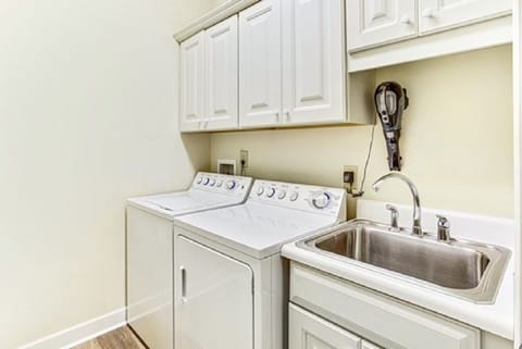 Large capacity washer/dryer; utility sink and storage
