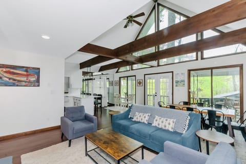 Open concept living area with 25 foot ceiling with amazing views to the lake.