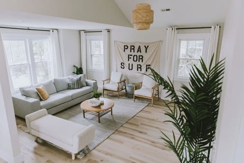 Bright, airy living room with cozy seating and plenty of space to relax.