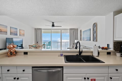 The fully equipped kitchen features quartz countertops, stainless-steel appliances, and has everything you need to prepare meals for family & friends.