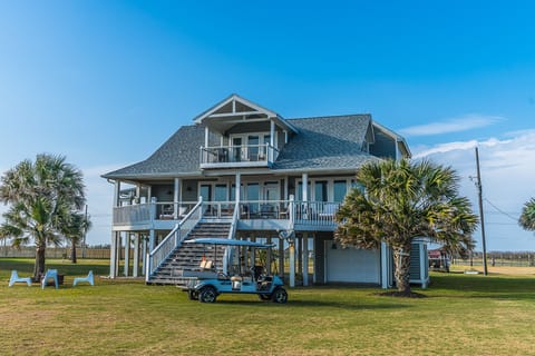 Exterior of house facing beach -- Golf cart available for rental