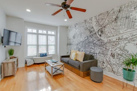 Spread out in this living room area complete with custom mural of the Downtown Nashville area.
