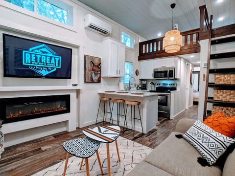 As you step inside, you'll find an eclectic true tiny home experience.