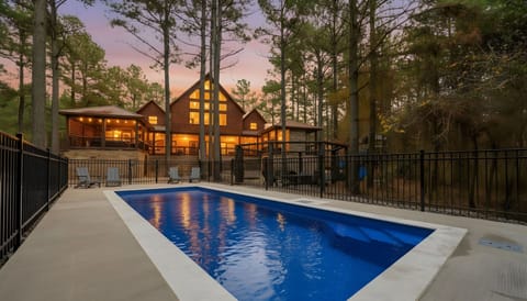 Step outside the kitchen to a backyard oasis with a heated pool, pickleball court, huge fire-pit, kids playset, and MORE!