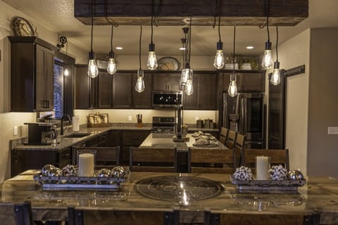 Dining room table with seating for 10 plus three more at the island.