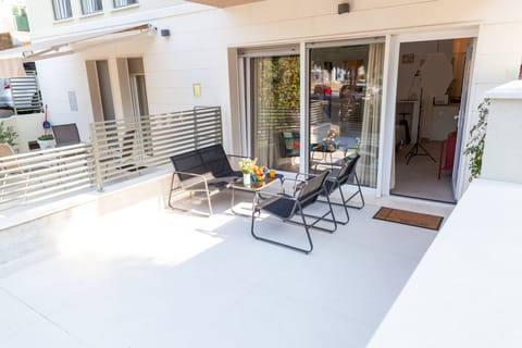 Patio with seating area. 