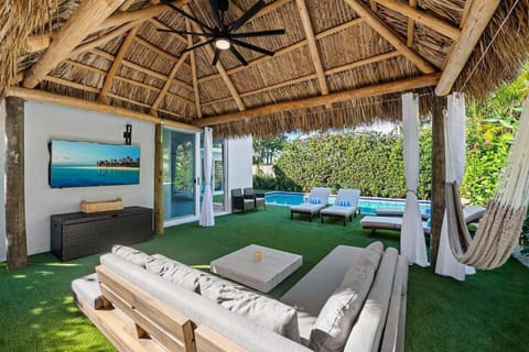"The outdoor sitting area with TV under the tiki hut was our favorite part. We spent every evening out there watching movies, shows, and enjoying the beautiful Florida weather. The hammock was a perfect touch." -Summer