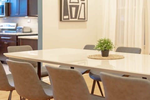 Dining room opening up to the fully stocked kitchen!