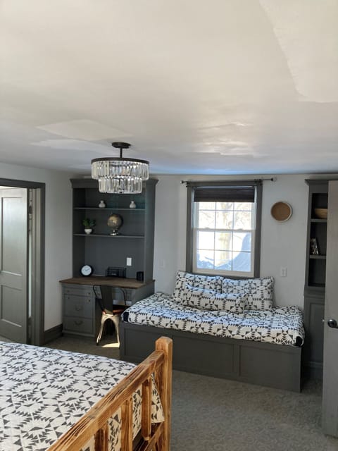 2nd Floor master family suite showing day bed. You can see entrance into queen