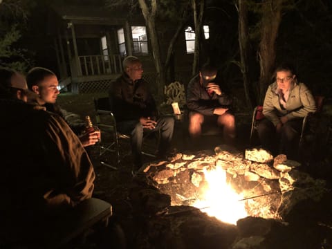 Hang with friends by the firepit at night