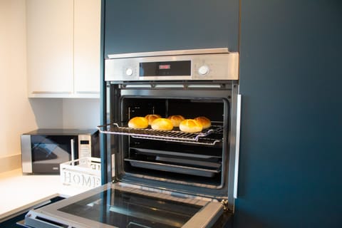 Kitchen is fully equipped with modern appliances