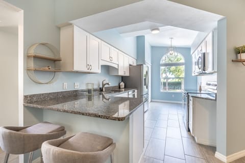 Kitchen peninsula has bar top seating for the quick meal or morning coffee. 