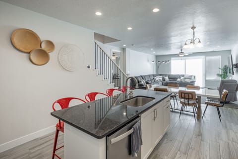 Kitchen - The Kitchen is complete with everything you will need for meal preparations including pots, pans, baking dishes, plates, cups, silverware, cutlery, and an assortment of cooking utensils.