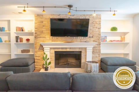 Your perfect getaway starts here! Enjoy movie nights in our inviting living room. #StayWithUs #CozyVibes #VacationRental