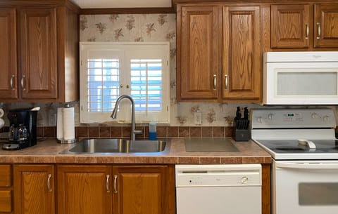 Full kitchen with stove/oven, microwave, dishwasher and coffee pot