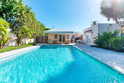 The home is a combination of rustic farmhouse meets Palm Beach tropic flair. The large heated pool, lovely outdoor lounging with BBQ, and bikes are sure to be a hit with any group.