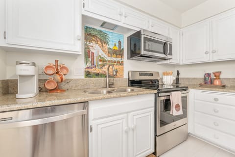 Dully stocked kitchen with all the cooking amenities. 