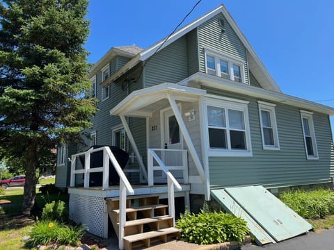 Back entrance with grill. Opens into the mudroom.
