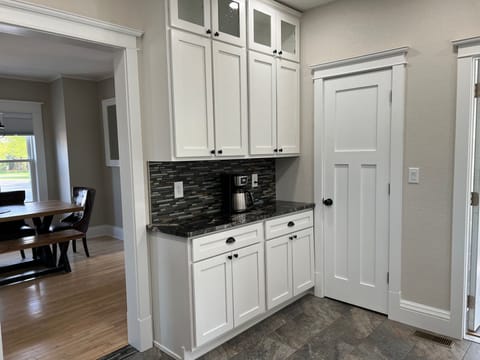 Another view of the kitchen. Door to pantry.