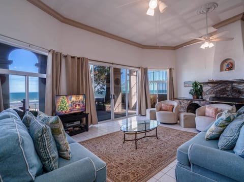 Relax in the living room at Casa Matas in San Felipe BC MX — comfortable seating with direct beachfront views.