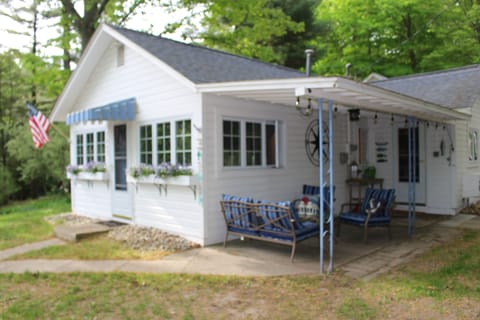 Front view of the Little White Cottage.  Entrance to the cottage from the porch.