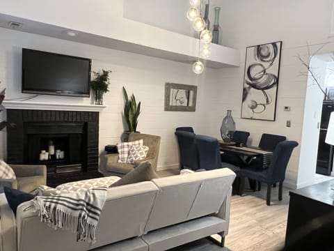 Living Room and Dining Room combo. 18' ceilings add to the open feel.