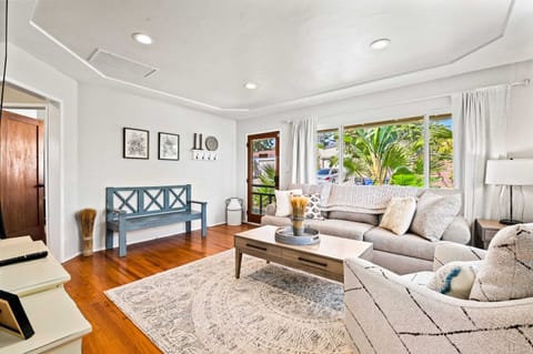 Living room (AC, TV, seating, air mattress)