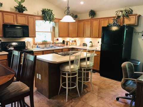 Kitchen island is nice for extra work space and bar for breakfast or coffee