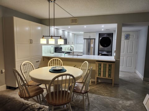 View of entrance and recently remodeled kitchen / dining area from Living Room.