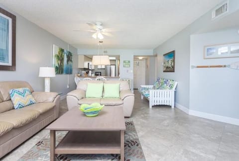 View of entrance and old kitchen / dining area from Living Room. Futon on right.