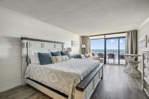The king bed sits just steps from oceanfront.