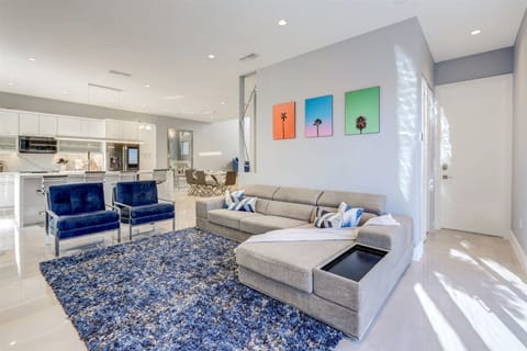 Grand living room features a sectional sofa & accent chairs